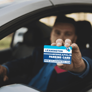 man holding commuter card SITTING IN CAR